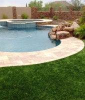 Beautiful 80oz Artificial Grass With Travertine Pool Deck And Centurion Stone Veneer Walls | Centurion Stone Of Arizona