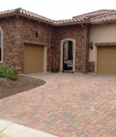 This Driveway Used Four Different Size Tierra Norte Pavers And Sillouette Suede Ledge Stone Veneers On The House Walls | Centurion Stone Of Arizona